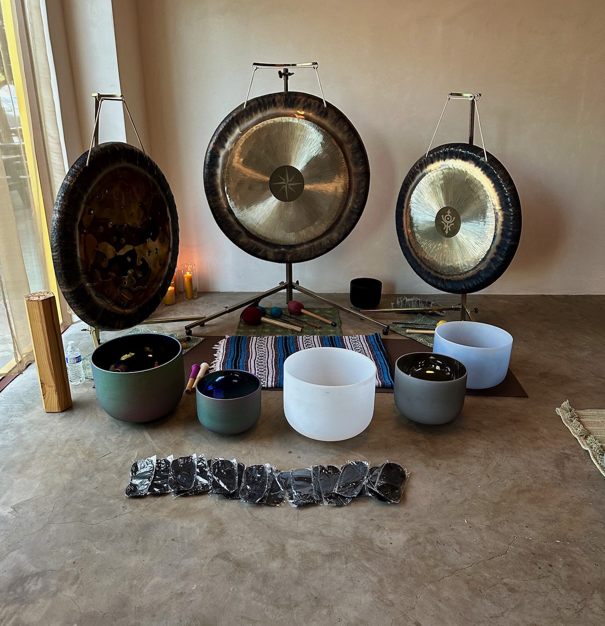 Three gongs and six crystal singing bowl mobile sound bath setup.