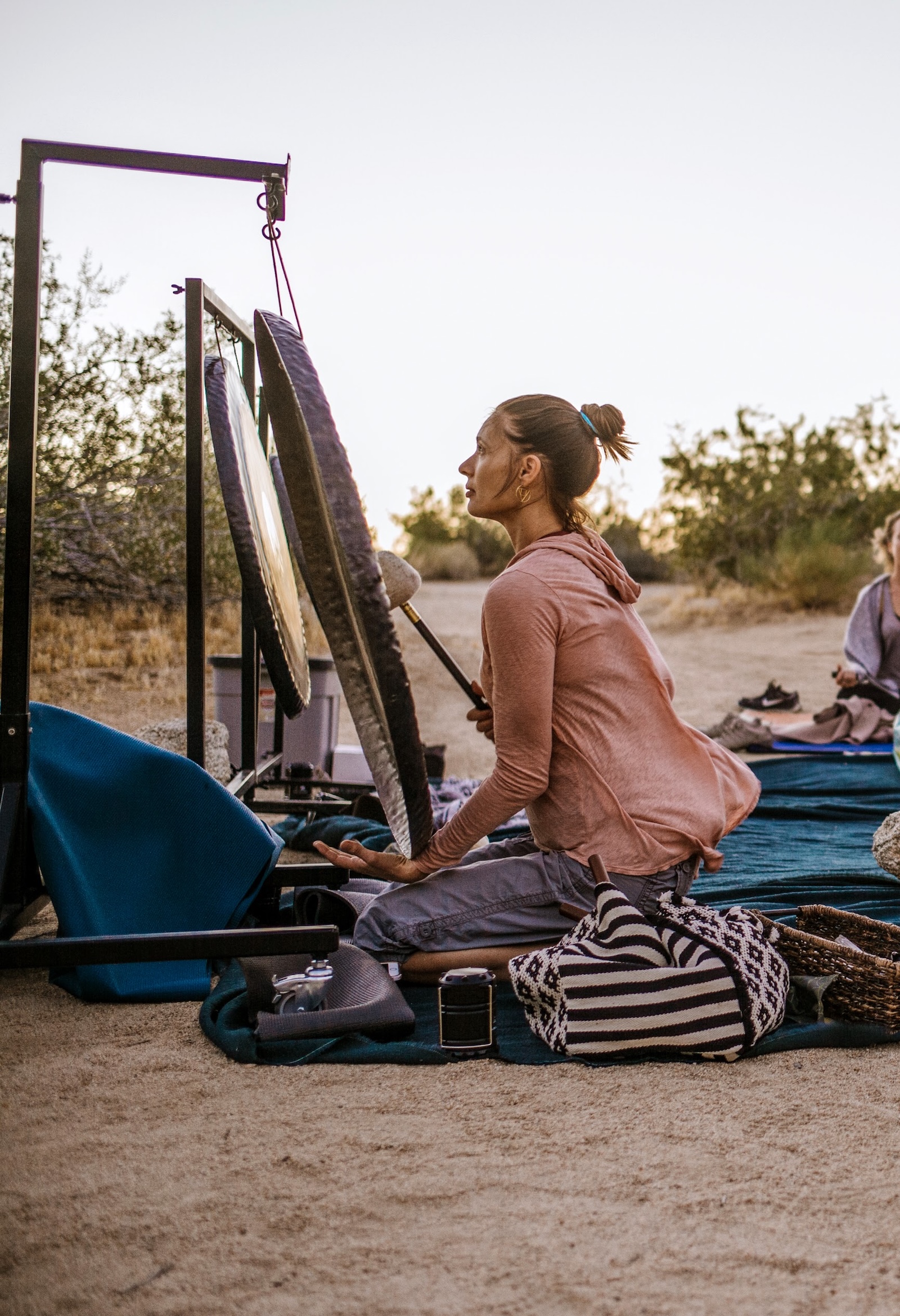Jamie Bechtold playing Paiste Sun Gong during gong sound bath in Joshua Tree